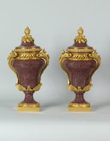 Rare pair of Egyptian porphyry ovoid vases with an ormolu mounting